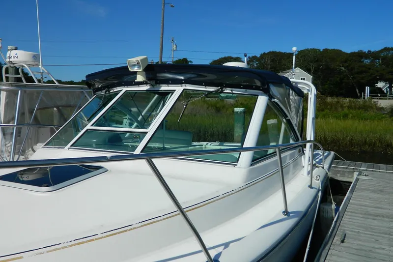 The Image of 1999 Tiara Yachts 2900 Coronet docked, showcasing sleek design and sturdy build. - 0