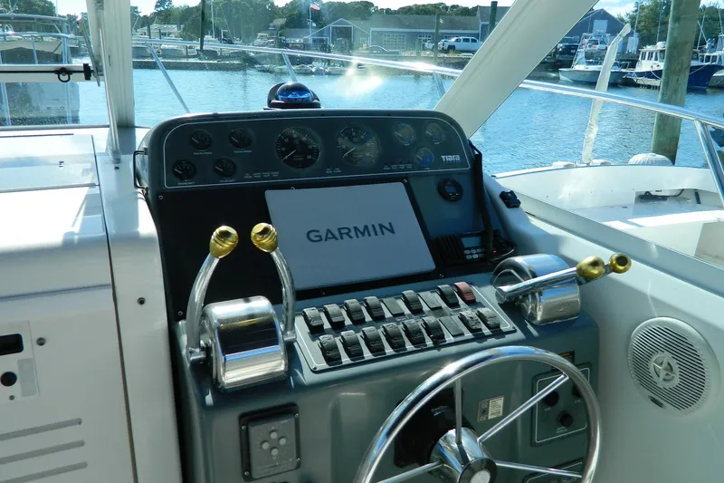 Slide: The Image of 1999 Tiara Yachts 2900 Coronet helm with Garmin navigation system and dual throttle controls. - 10