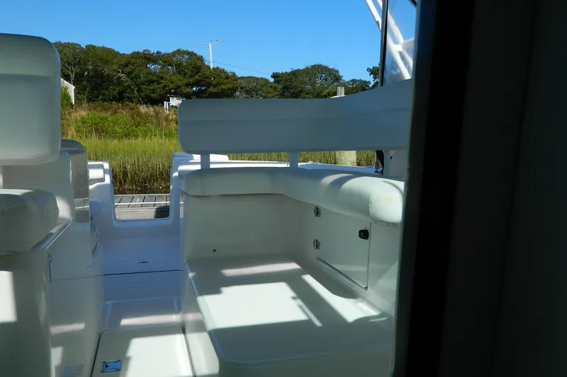 Slide: The Image of 1999 Tiara Yachts 2900 Coronet interior with white seating and outdoor view. - 5