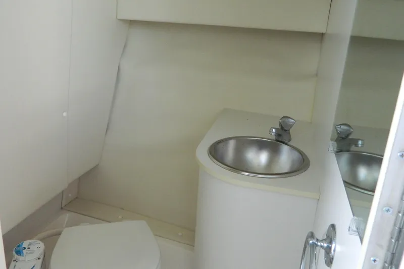 Slide: The Image of 1999 Tiara Yachts 2900 Coronet bathroom with sink and toilet. - 9