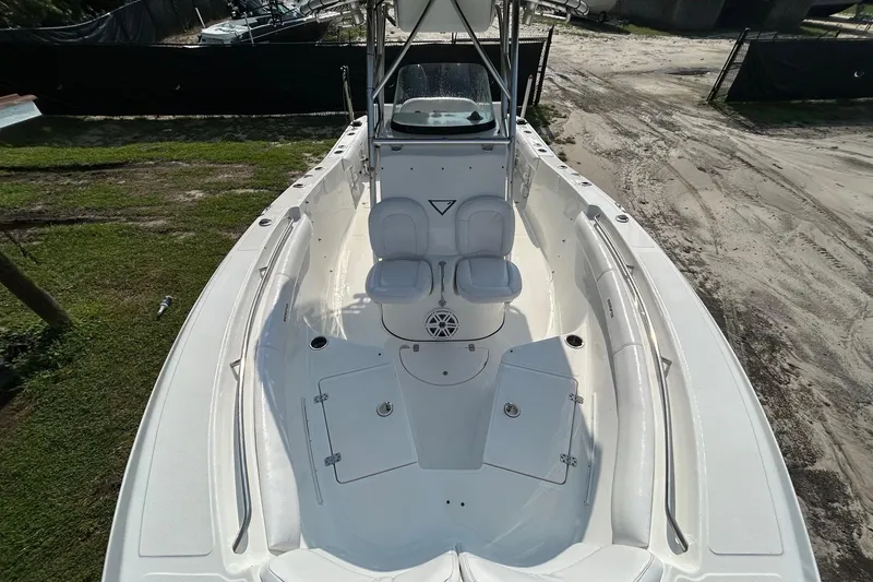 Slide: The Image of 2008 Sea Fox 256 Commander boat interior, featuring spacious seating and storage compartments. - 3