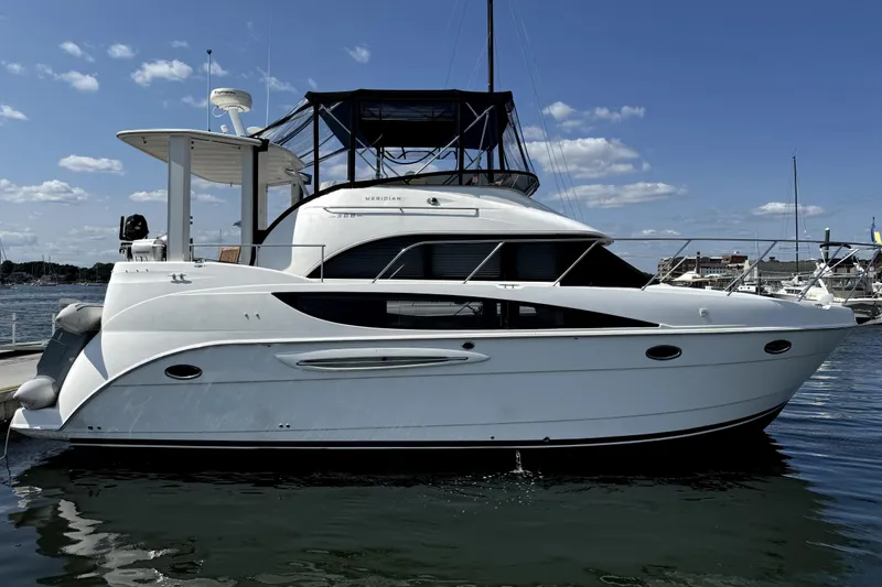 The Image of 2005 Meridian 368 Motoryacht docked on a sunny day, showcasing sleek design. - 0