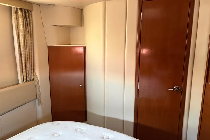 Slide: The Image of Interior of 2005 Meridian 368 Motoryacht with wooden doors and beige walls. - 52