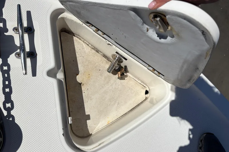 Slide: The Image of Open hatch on 2005 Meridian 368 Motoryacht deck, showing storage compartment. - 11