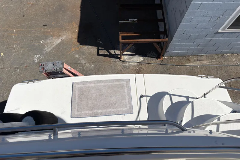 Slide: The Image of 2005 Meridian 368 Motoryacht deck view with ladder and dockside setup. - 14