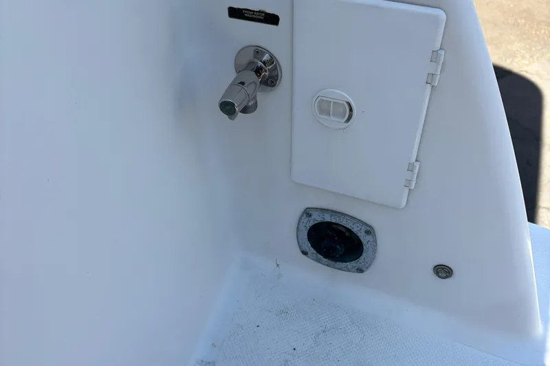 Slide: The Image of 2005 Meridian 368 Motoryacht deck detail with water hookup and storage compartment. - 16