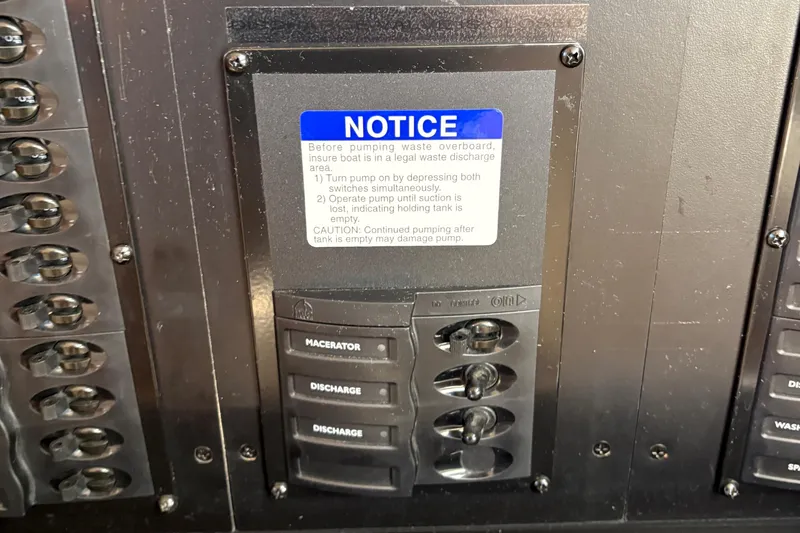 Slide: The Image of Control panel of a 2005 Meridian 368 Motoryacht with waste management instructions. - 48