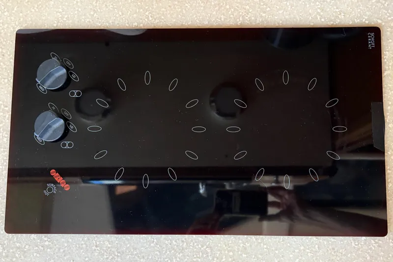 Slide: The Image of Glass stovetop with control knobs on a 2005 Meridian 368 Motoryacht. - 23