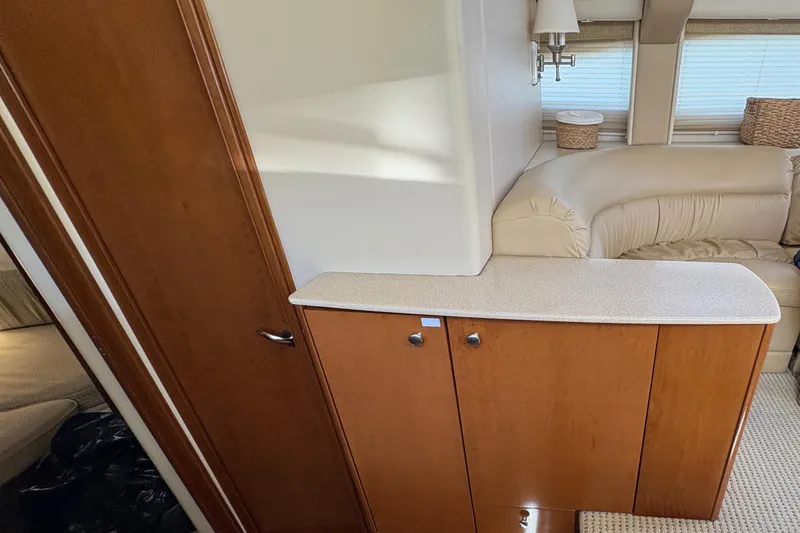 Slide: The Image of Interior of 2005 Meridian 368 Motoryacht with wooden cabinetry and beige seating. - 25