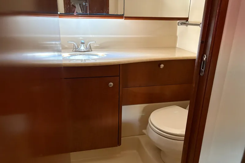 Slide: The Image of 2005 Meridian 368 Motoryacht bathroom with wooden cabinetry and modern fixtures. - 56