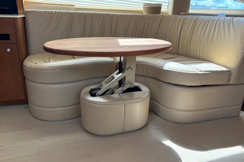 Slide: The Image of Luxurious interior of 2005 Meridian 368 Motoryacht with leather seating and adjustable table. - 28