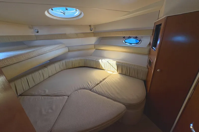 Slide: The Image of Luxurious cabin interior of 2005 Meridian 368 Motoryacht with cozy seating and porthole window. - 33