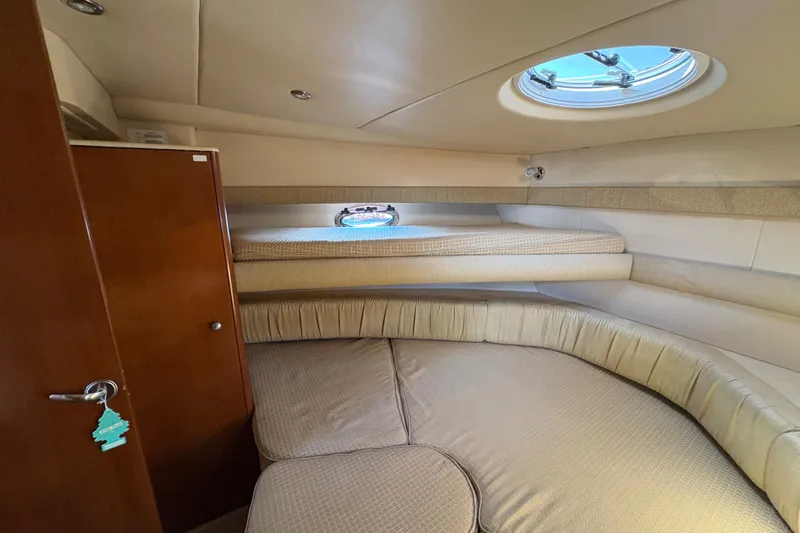 Slide: The Image of Interior cabin of 2005 Meridian 368 Motoryacht with cozy seating and porthole window. - 34