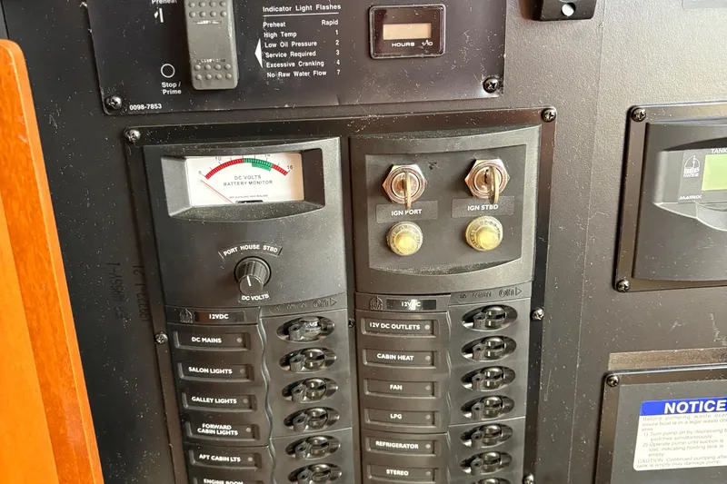 Slide: The Image of Control panel of a 2005 Meridian 368 Motoryacht with battery monitor and switches. - 44