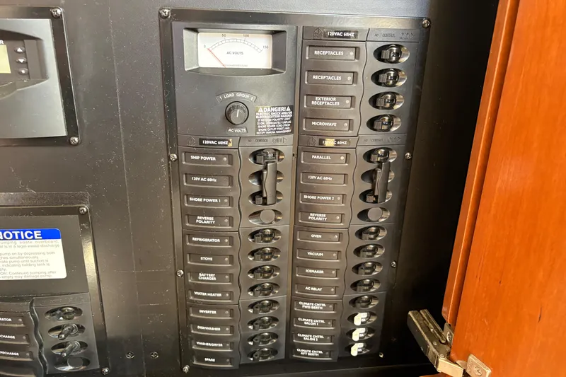 Slide: The Image of Electrical panel of 2005 Meridian 368 Motoryacht with labeled switches and voltmeter. - 45