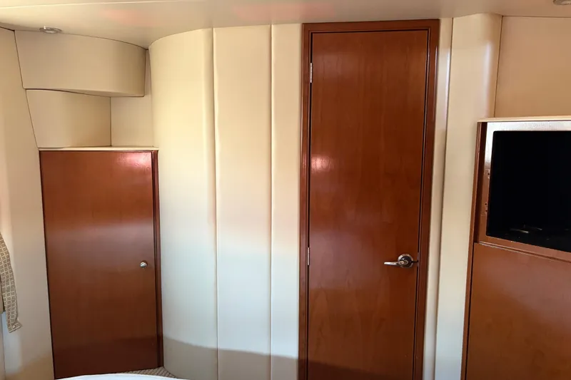 Slide: The Image of Interior of 2005 Meridian 368 Motoryacht with wooden doors and built-in storage. - 53
