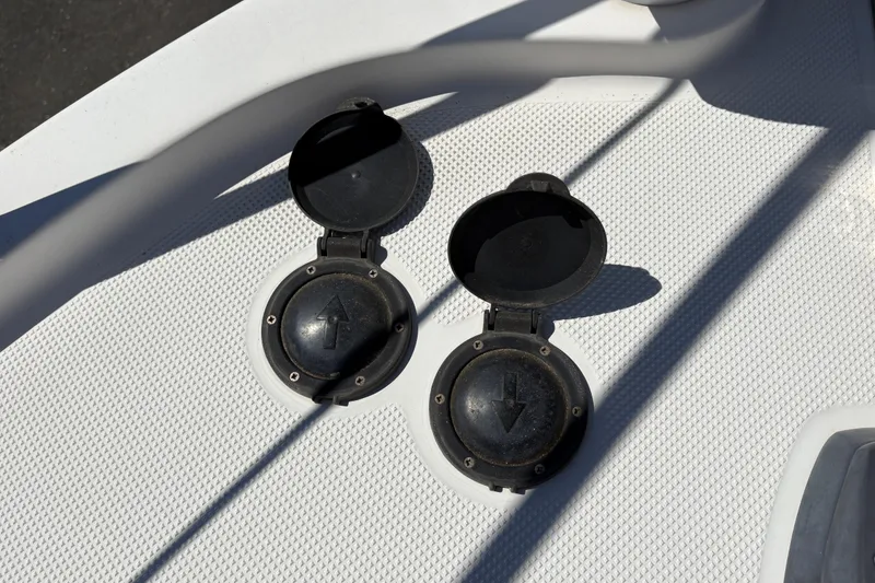 Slide: The Image of 2005 Meridian 368 Motoryacht deck with open black hatches, textured surface. - 12
