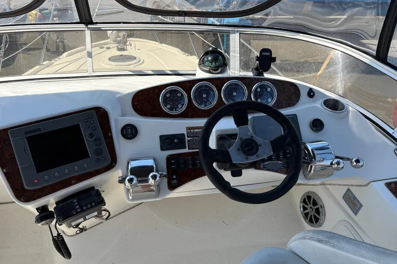 Slide: The Image of Helm of 2005 Meridian 368 Motoryacht with steering wheel and navigation instruments. - 64