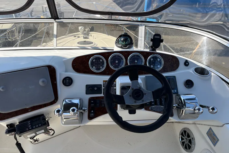 Slide: The Image of Helm of 2005 Meridian 368 Motoryacht with steering wheel and navigation instruments. - 65