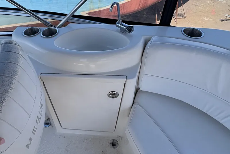 Slide: The Image of 2005 Meridian 368 Motoryacht interior with sink, cup holders, and seating. - 68