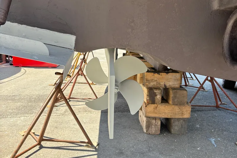 Slide: The Image of Propeller of 2005 Meridian 368 Motoryacht on dry dock, supported by wooden blocks. - 74