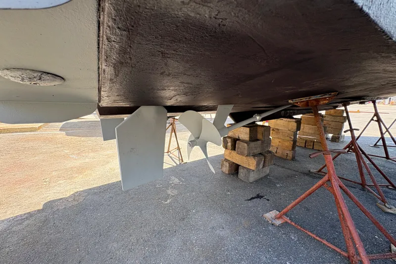 Slide: The Image of Underside view of 2005 Meridian 368 Motoryacht on dry dock with visible propeller. - 75