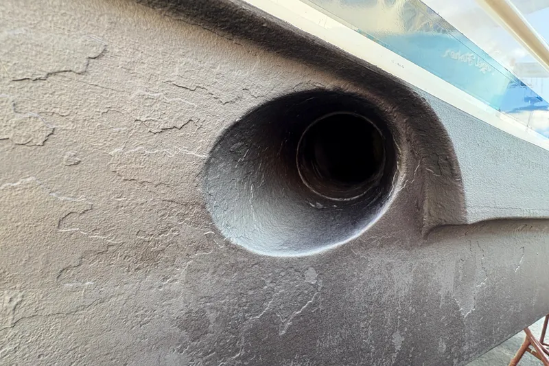 Slide: The Image of Close-up of a 2005 Meridian 368 Motoryacht hull with visible thruster tunnel. - 81