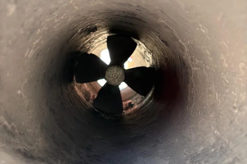 Slide: The Image of Close-up of a propeller inside a 2005 Meridian 368 Motoryacht tunnel. - 84