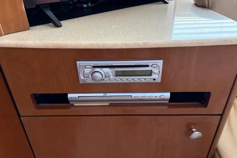 Slide: The Image of 2005 Meridian 368 Motoryacht interior with CD and DVD players in wooden cabinet. - 30