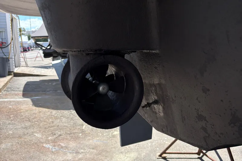 Slide: The Image of Close-up of a 2005 Meridian 368 Motoryacht propeller in a boatyard setting. - 86