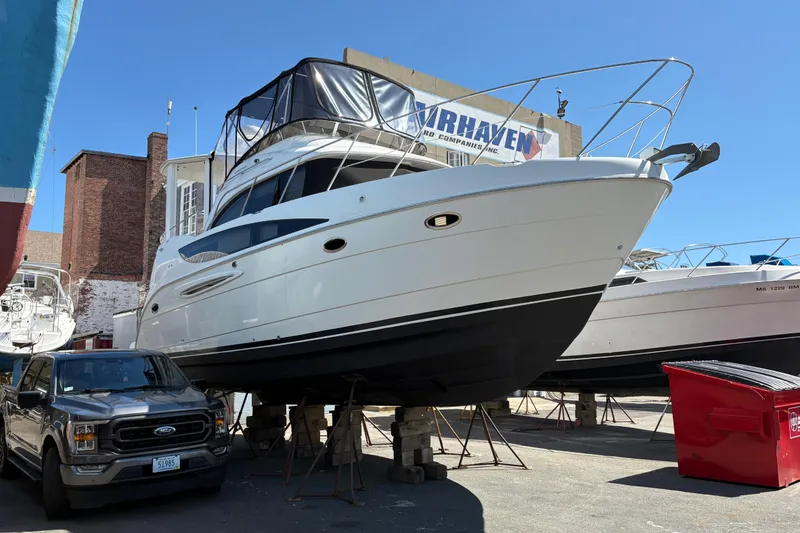 Slide: The Image of 2005 Meridian 368 Motoryacht on dry dock, with truck and buildings nearby. - 5