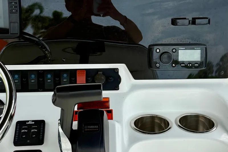 Slide: The Image of 2019 Sea Hunt BX 20 BR boat dashboard with controls and cup holders. - 29