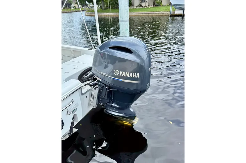 Slide: The Image of 2019 Sea Hunt BX 20 BR boat with Yamaha outboard motor on water. - 5