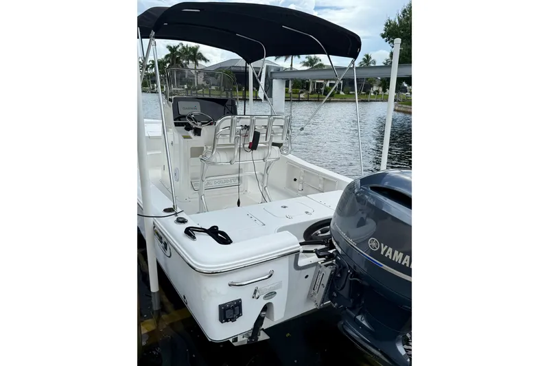 Slide: The Image of 2019 Sea Hunt BX 20 BR boat with Yamaha engine, docked by a waterfront. - 6