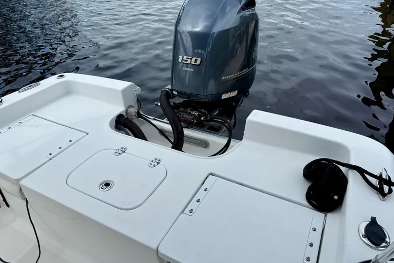 Slide: The Image of 2019 Sea Hunt BX 20 BR boat with Yamaha 150 outboard motor on water. - 7