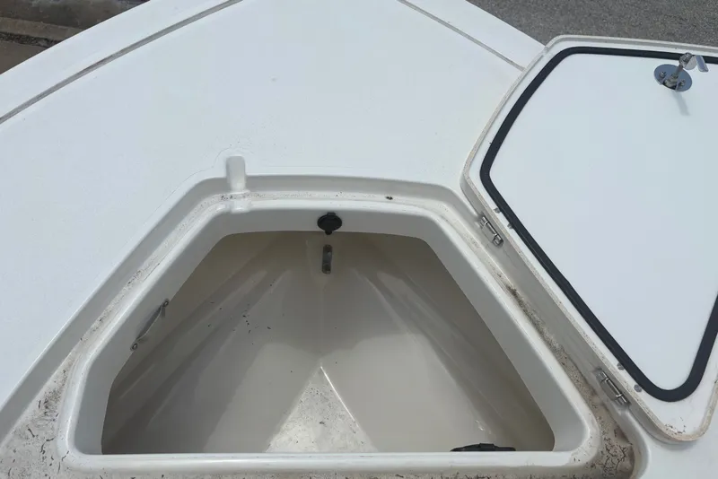 Slide: The Image of Open storage compartment on a 2026 Mako 18 Pro Skiff boat. - 11