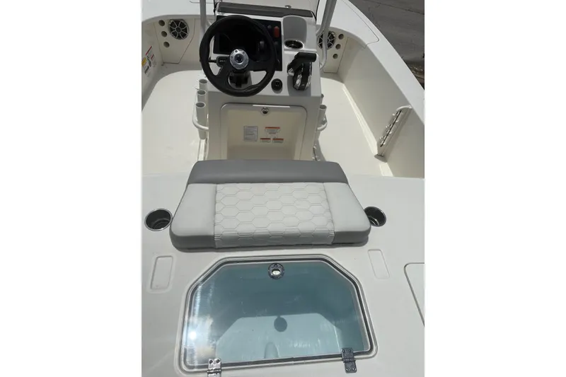 Slide: The Image of 2026 Mako 18 Pro Skiff boat interior with steering console and seating. - 15