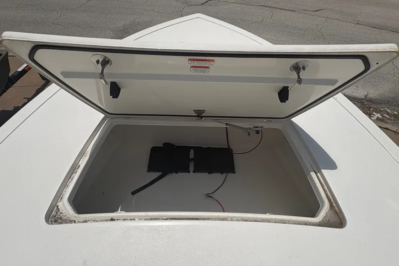 Slide: The Image of Open storage compartment on a 2026 Mako 18 Pro Skiff boat. - 12