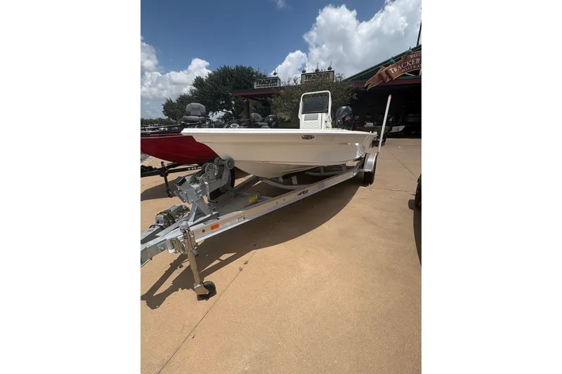 Slide: The Image of 2026 Mako 18 Pro Skiff boat on trailer under sunny sky. - 75