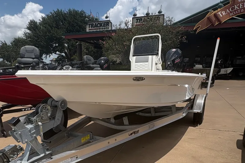 The Image of 2026 Mako 18 Pro Skiff boat on trailer under a sunny sky. - 0