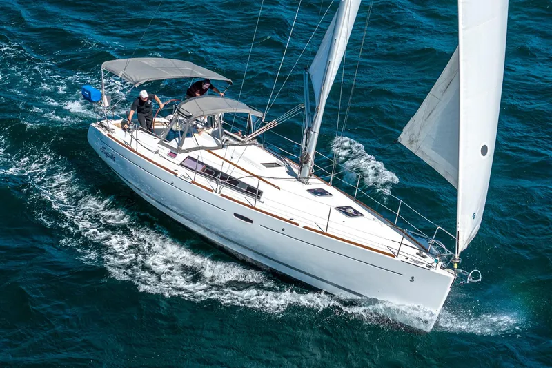 The Image of 2011 Beneteau Oceanis 37 sailing on open water, showcasing sleek design and performance. - 1