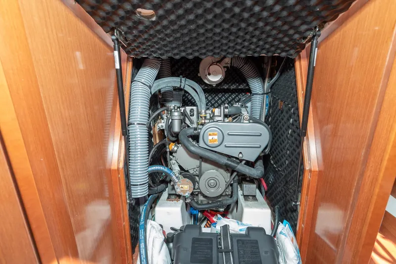 Slide: The Image of Engine compartment of 2011 Beneteau Oceanis 37 sailboat, showcasing mechanical components. - 28