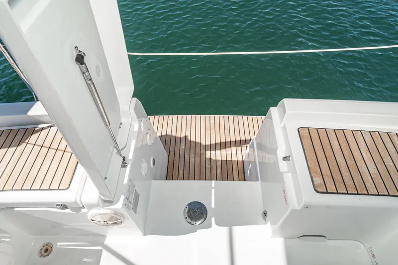 Slide: The Image of Beneteau Oceanis 37 (2011) yacht deck with teak flooring and ocean view. - 37
