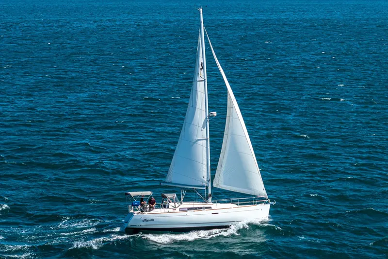 Slide: The Image of 2011 Beneteau Oceanis 37 sailing on open sea with white sails. - 5