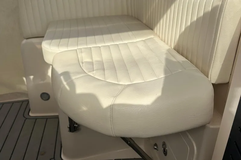 Slide: The Image of 2008 Grady-White Express 330 boat interior at dock, featuring spacious deck and seating. - 13