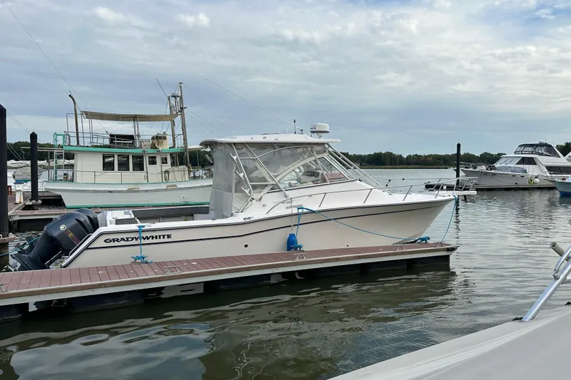Slide: The Image of Control panel of a 2008 Grady-White Express 330 boat with Yamaha throttle. - 22