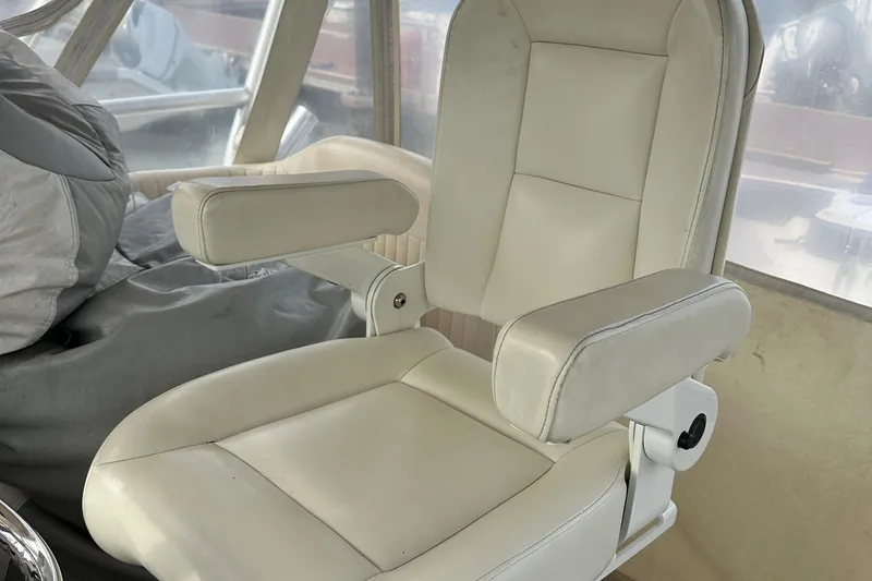 Slide: The Image of 2008 Grady-White Express 330 helm with steering wheel, controls, and navigation equipment. - 29