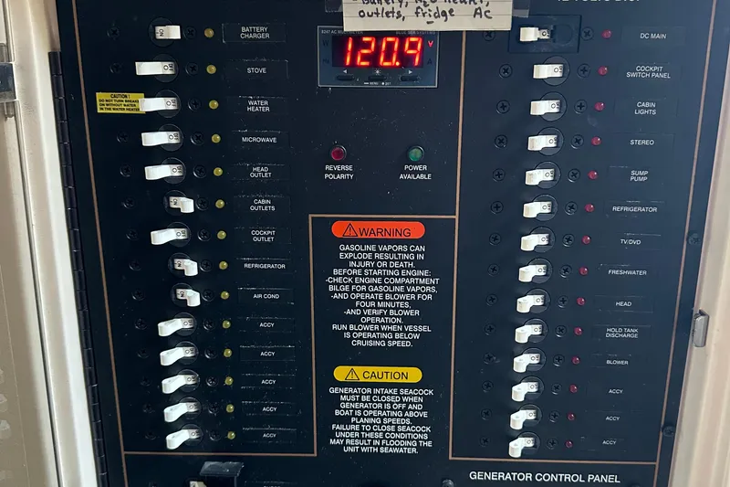 Slide: The Image of Electrical control panel on a 2008 Grady-White Express 330 boat. - 37