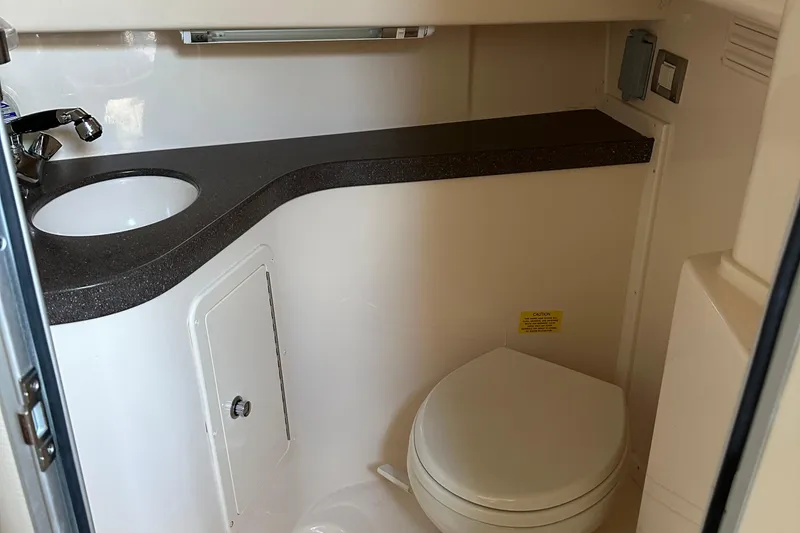 Slide: The Image of 2008 Grady-White Express 330 boat bathroom with sink and toilet. - 38