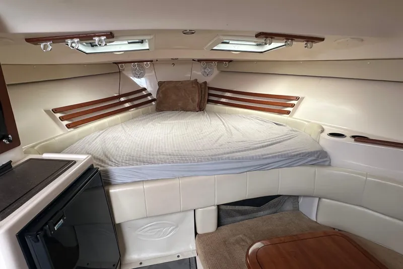 Slide: The Image of 2008 Grady-White Express 330 cabin interior with bed, skylights, and seating area. - 41